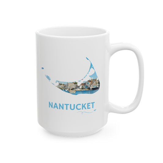 White 15 oz ceramic mug featuring a hand-drawn Nantucket outline filled with a scenic harbor view of classic island homes and boats. The word "Nantucket" appears below the artwork with a small airplane icon and looping flight path.