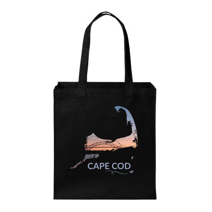 Black Cape Cod tote bag featuring the Bourne Bridge at sunset inside the Cape Cod outline, light blue Cape Cod lettering, and a small airplane with swirl