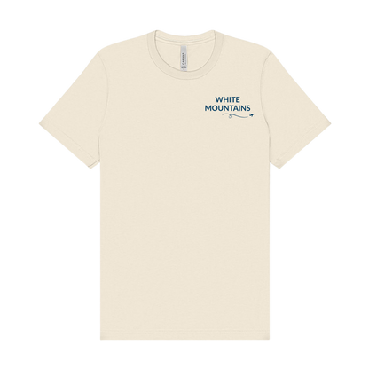 Natural t-shirt featuring “White Mountains” on the left chest in navy with a small airplane icon and looping flight path.