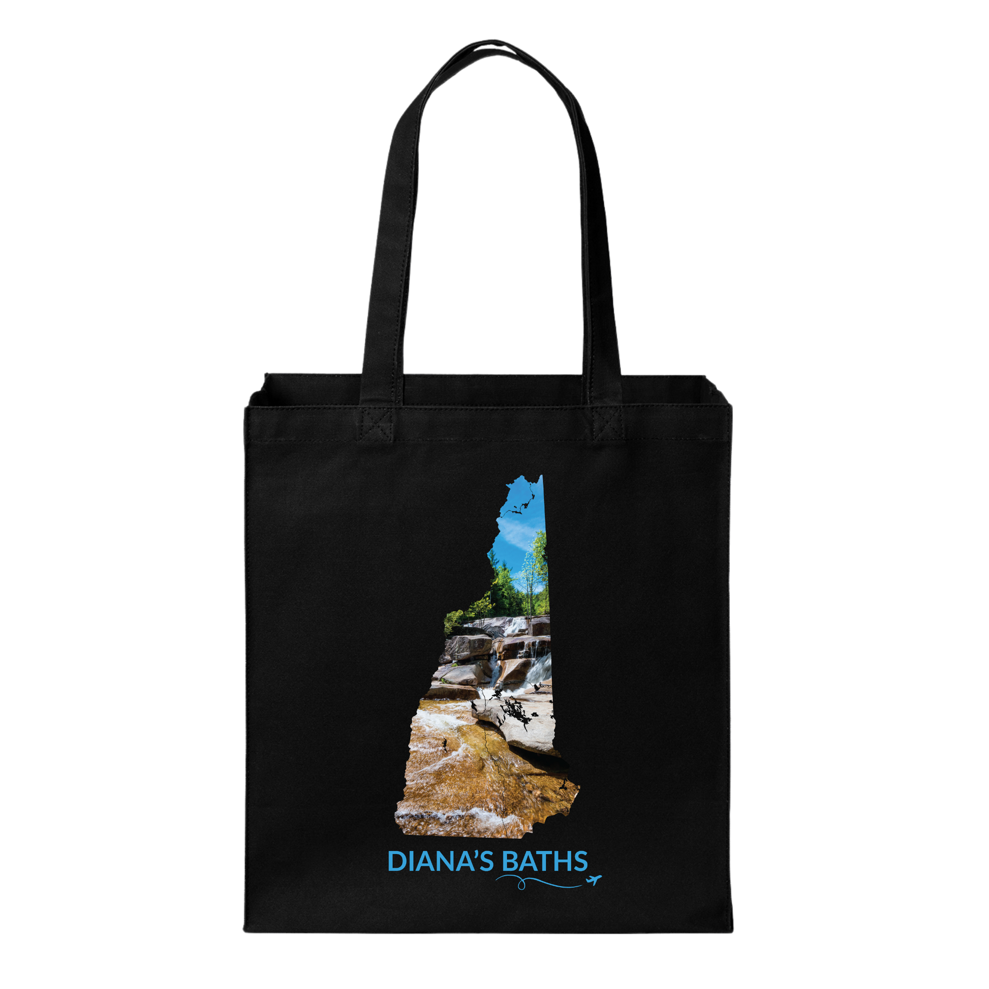 Black canvas tote bag featuring a hand-drawn New Hampshire outline filled with a photograph of the waterfalls and granite ledges at Diana’s Baths. The words “Diana’s Baths” appear below the artwork with a small airplane icon and looping flight path.