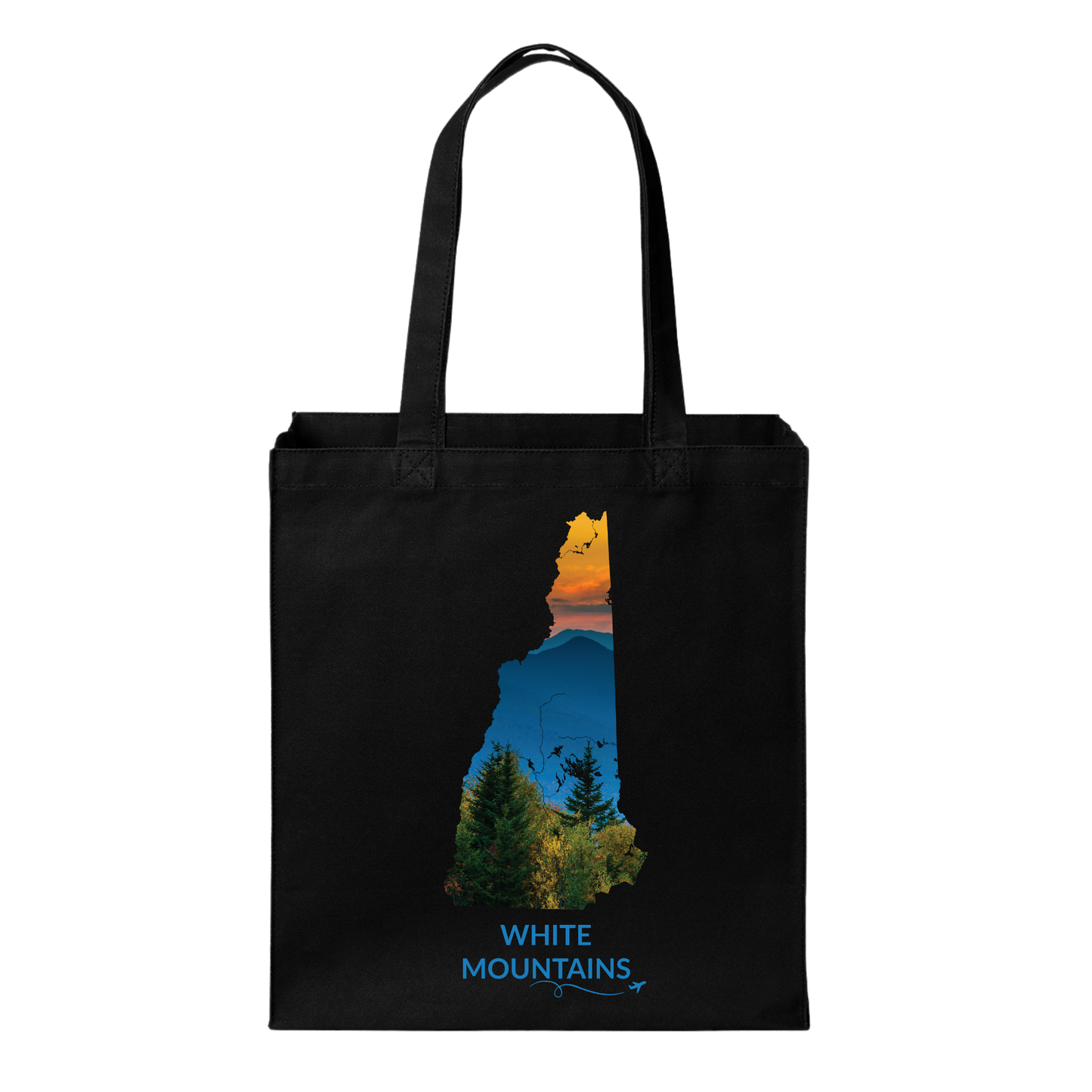 Black canvas tote bag featuring a hand-drawn New Hampshire outline filled with a photograph of the White Mountains, evergreen trees, and sunset. The words “White Mountains” appear below with a small airplane icon and looping flight path.