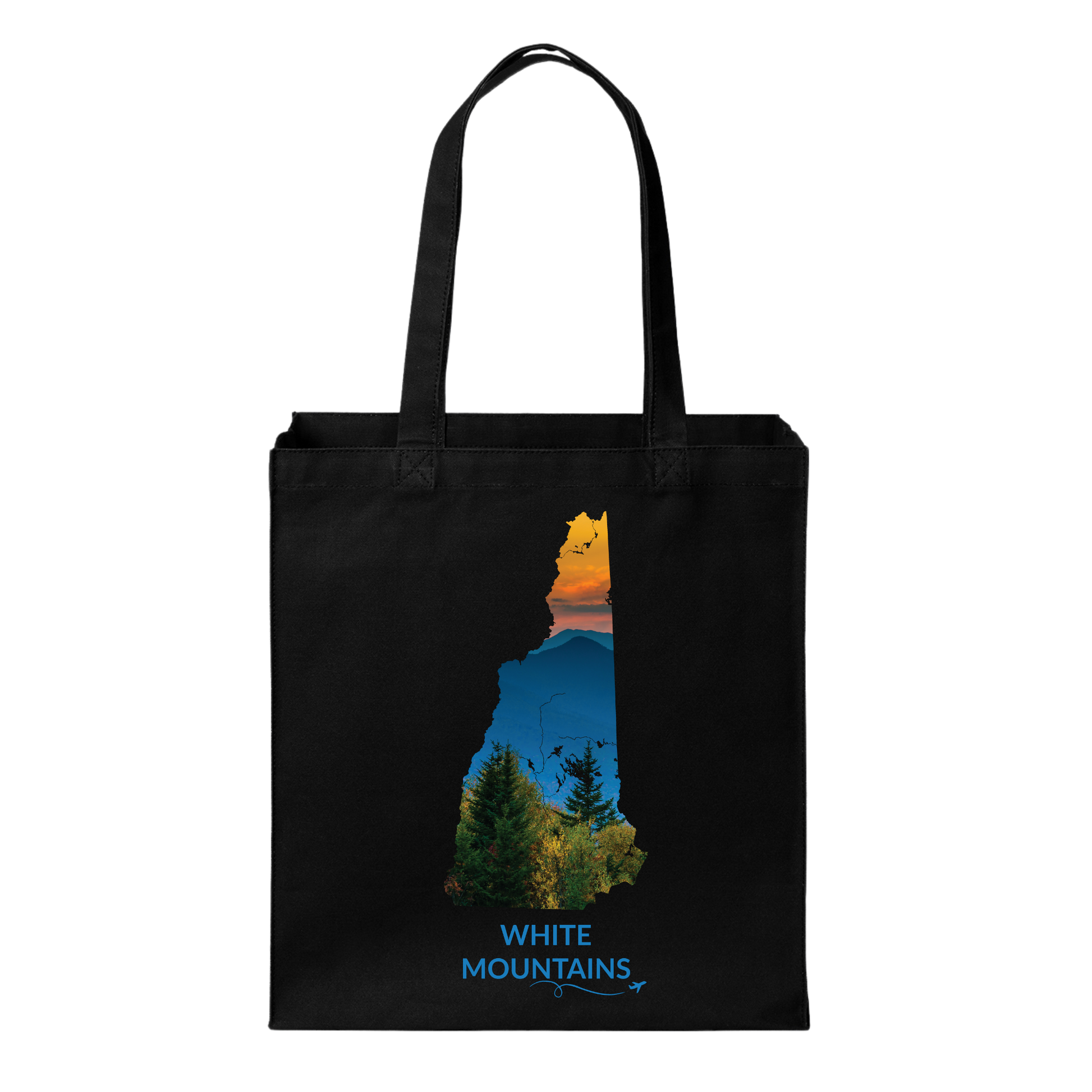 Black canvas tote bag featuring a hand-drawn New Hampshire outline filled with a photograph of the White Mountains, evergreen trees, and sunset. The words “White Mountains” appear below with a small airplane icon and looping flight path.