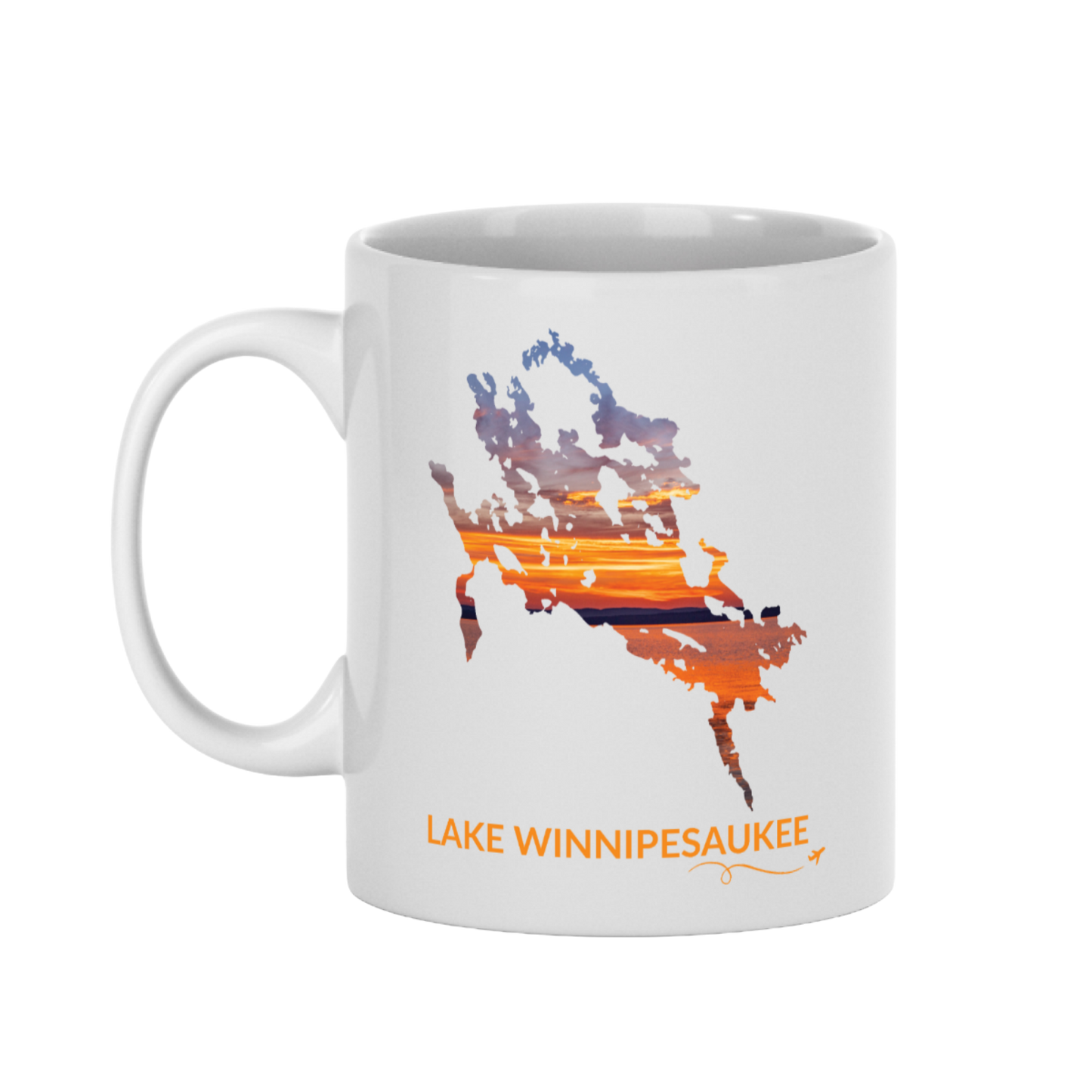 White 11 oz ceramic mug featuring a hand-drawn outline of Lake Winnipesaukee filled with a photograph of an orange and gold sunset captured on the lake. The words “Lake Winnipesaukee” appear below the artwork with a small airplane icon and looping flight path.