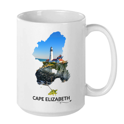 White 15 oz Cape Elizabeth mug featuring Portland Head Light, rocky coastline and blue ocean inside the Cape Elizabeth outline, black Cape Elizabeth lettering, and a small airplane with swirl