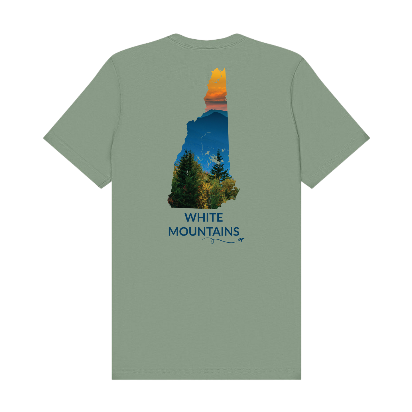 Sage t-shirt featuring a hand-drawn New Hampshire outline filled with a photograph of the White Mountains, with evergreen trees, layered mountain peaks, and an orange sunset sky. The words “White Mountains” appear below the artwork with a small airplane icon and looping flight path.
