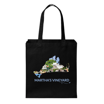 Black cotton canvas tote bag featuring a hand-drawn Martha's Vineyard outline filled with Edgartown Harbor, historic homes, and coastal scenery. The words "Martha's Vineyard" appear below the artwork with a small airplane icon and looping flight path.