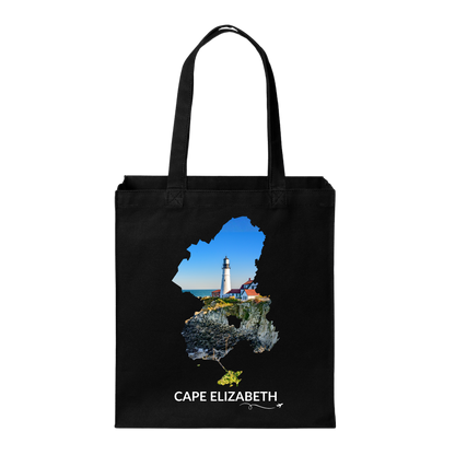 Black Cape Elizabeth tote bag featuring Portland Head Light and the rocky Maine coastline inside the Cape Elizabeth outline, white Cape Elizabeth lettering, and a small airplane with swirl