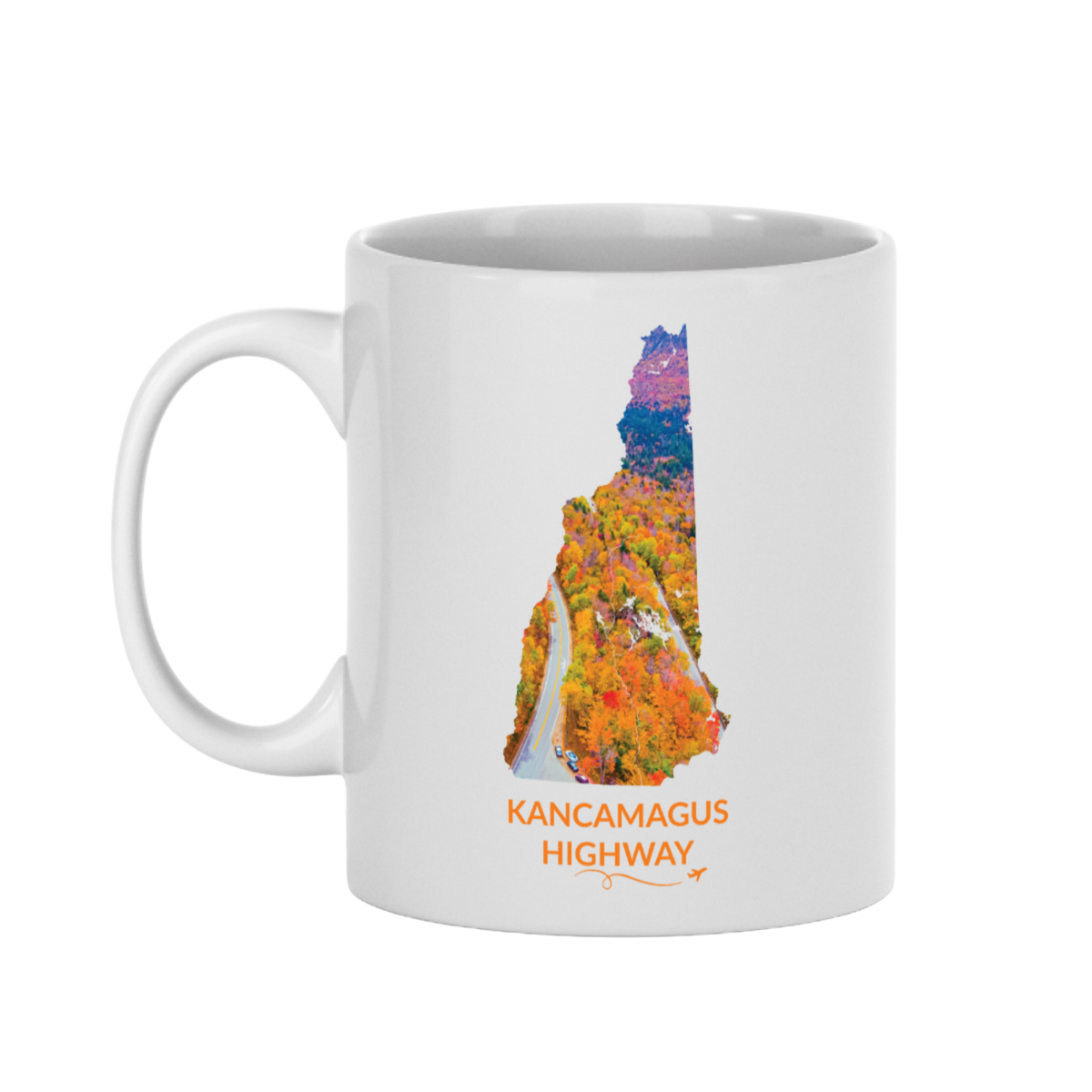 White 11 oz ceramic mug featuring a hand-drawn New Hampshire outline filled with a photograph of the Kancamagus Highway winding through vibrant fall foliage. The words "Kancamagus Highway" appear below the artwork with a small airplane icon and looping flight path.