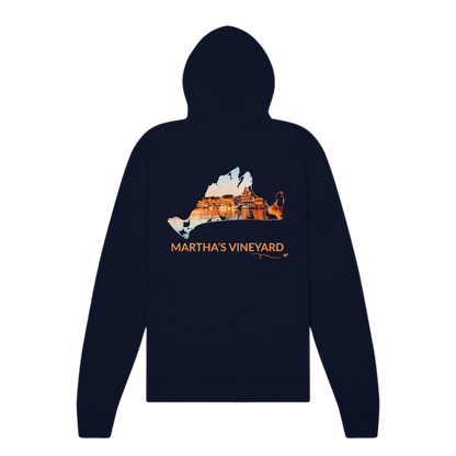 Back of navy Martha's Vineyard zip-up hoodie featuring a real photo of Oak Bluffs Harbor at sunset inside a hand-traced island outline, with Martha's Vineyard lettering and airplane swirl