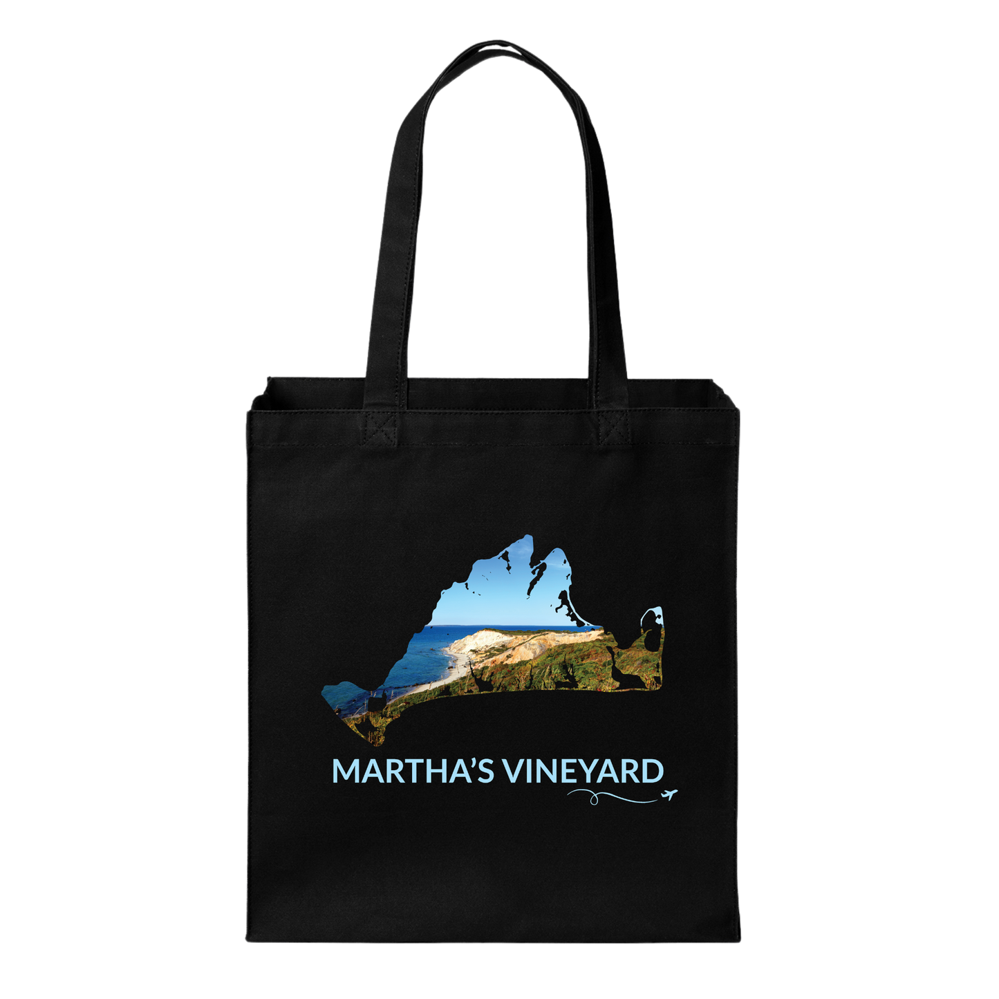 Black cotton canvas tote bag featuring a hand-drawn Martha's Vineyard outline filled with a scenic view of the Aquinnah Cliffs and Atlantic Ocean. The words "Martha's Vineyard" appear below the artwork with a small airplane icon and looping flight path.