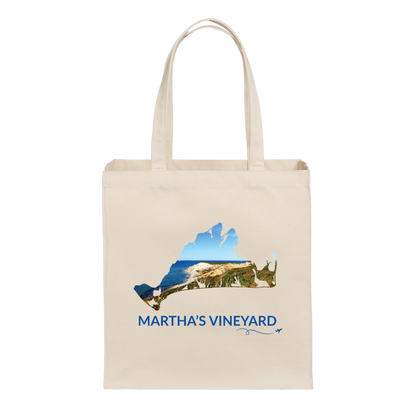 Natural cotton canvas tote bag featuring a hand-drawn Martha's Vineyard outline filled with the Aquinnah Cliffs and ocean. The words "Martha's Vineyard" appear below the artwork with a small airplane icon and looping flight path.