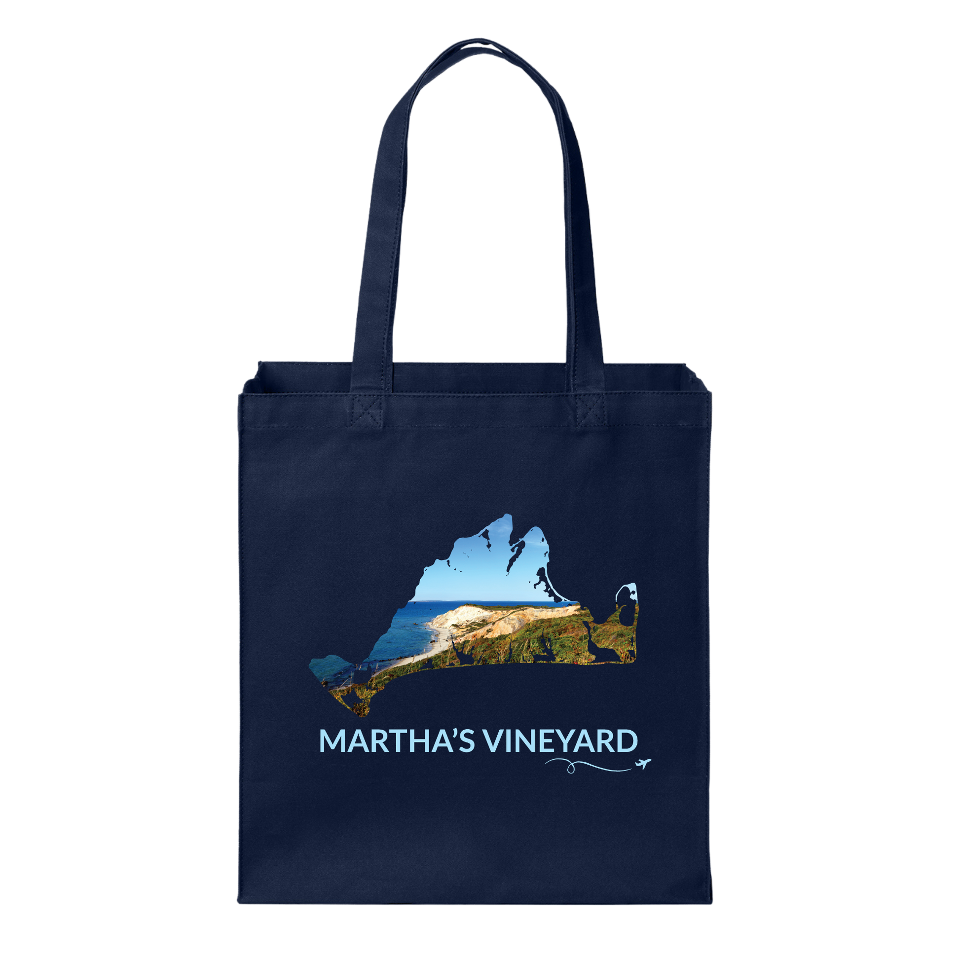 Navy cotton canvas tote bag featuring a hand-drawn Martha's Vineyard outline with the Aquinnah Cliffs and Atlantic Ocean inside the outline. The words "Martha's Vineyard" appear below the artwork with a small airplane icon and looping flight path.