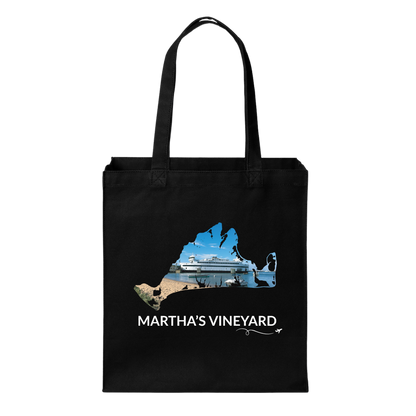 Black cotton canvas tote bag featuring a hand-drawn Martha's Vineyard outline filled with the Steamship Authority ferry docked in Vineyard Haven with the harbor, beach, and water. The words "Martha's Vineyard" appear below the artwork with a small airplane icon and looping flight path.