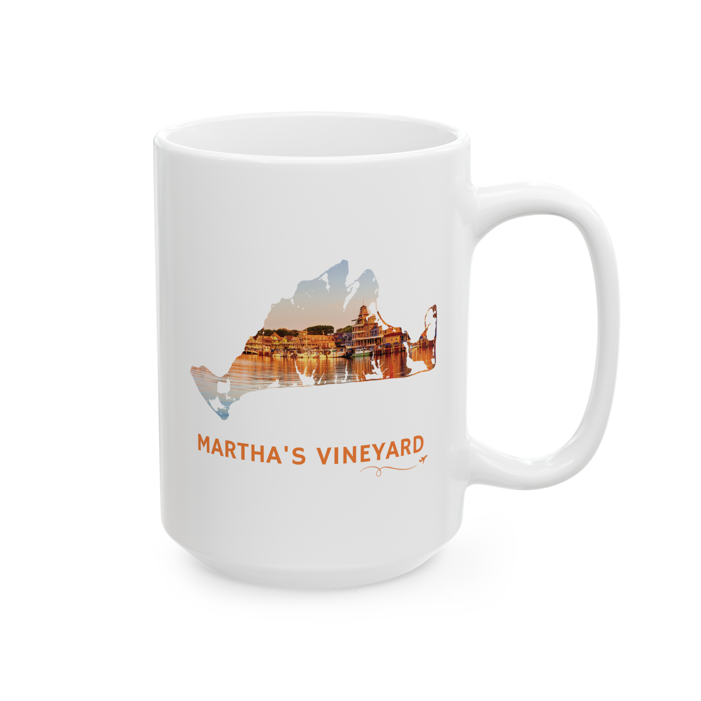 15 oz white ceramic mug featuring a hand-drawn Martha's Vineyard outline showcasing Oak Bluffs Harbor at sunset. "Martha's Vineyard" appears below the artwork with a small airplane icon and looping flight path.