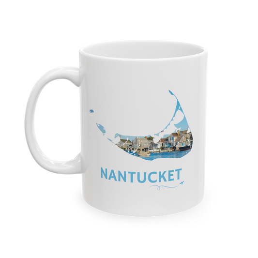 White 11 oz ceramic mug featuring a hand-drawn Nantucket outline filled with a scenic harbor view of classic island homes and boats. The word "Nantucket" appears below the artwork with a small airplane icon and looping flight path.