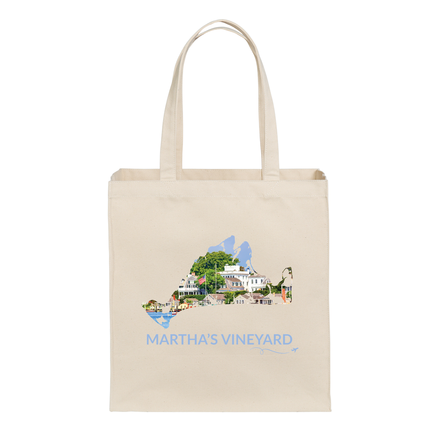 Natural cotton canvas tote bag featuring a hand-drawn Martha's Vineyard outline filled with Edgartown Harbor, historic homes, and waterfront scenery. The words "Martha's Vineyard" appear below the artwork with a small airplane icon and looping flight path.