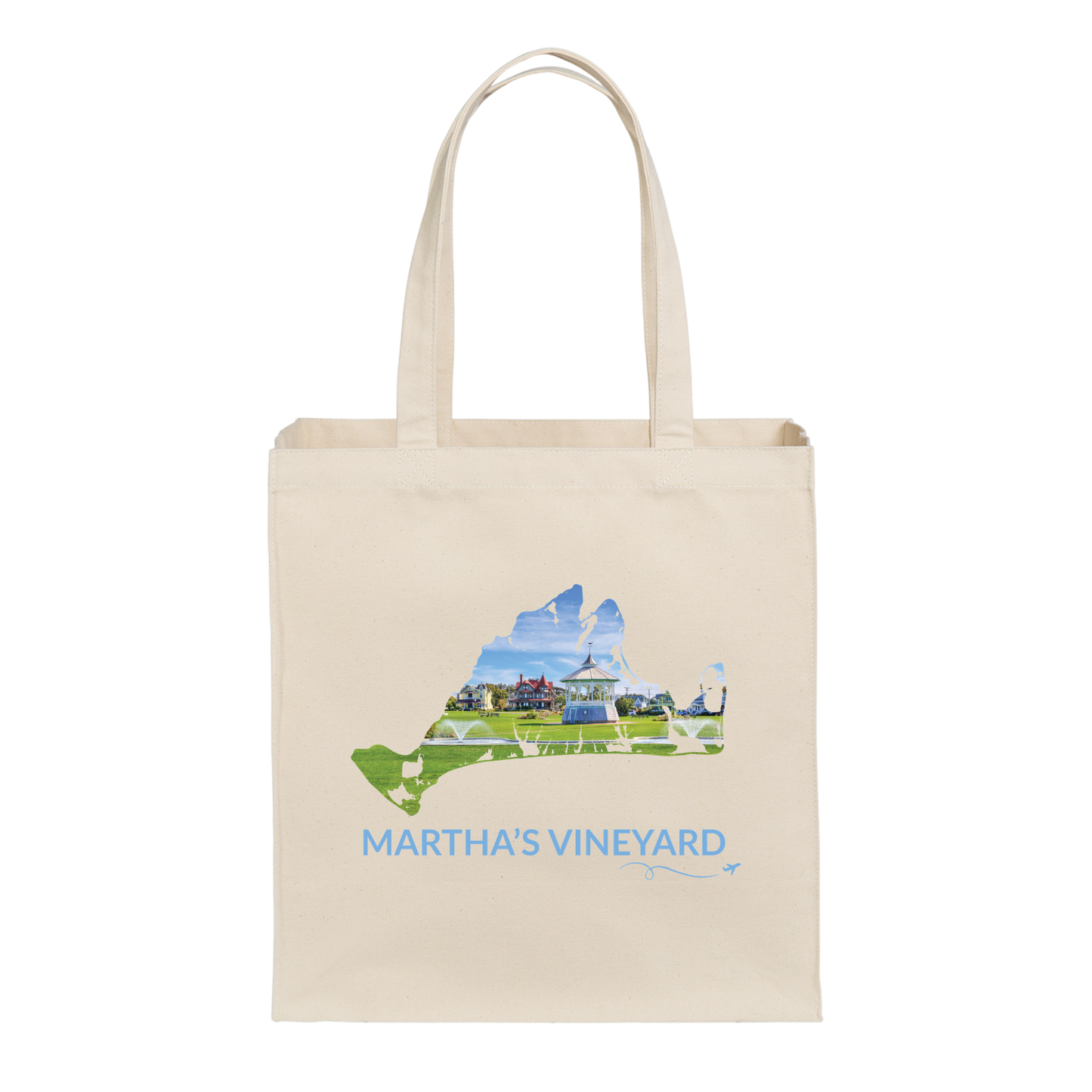 Natural cotton canvas tote bag featuring a hand-drawn Martha's Vineyard outline showcasing the Ocean Park gazebo surrounded by green lawns and colorful cottages in Oak Bluffs. The words "Martha's Vineyard" appear below the artwork with a small airplane icon and looping flight path.