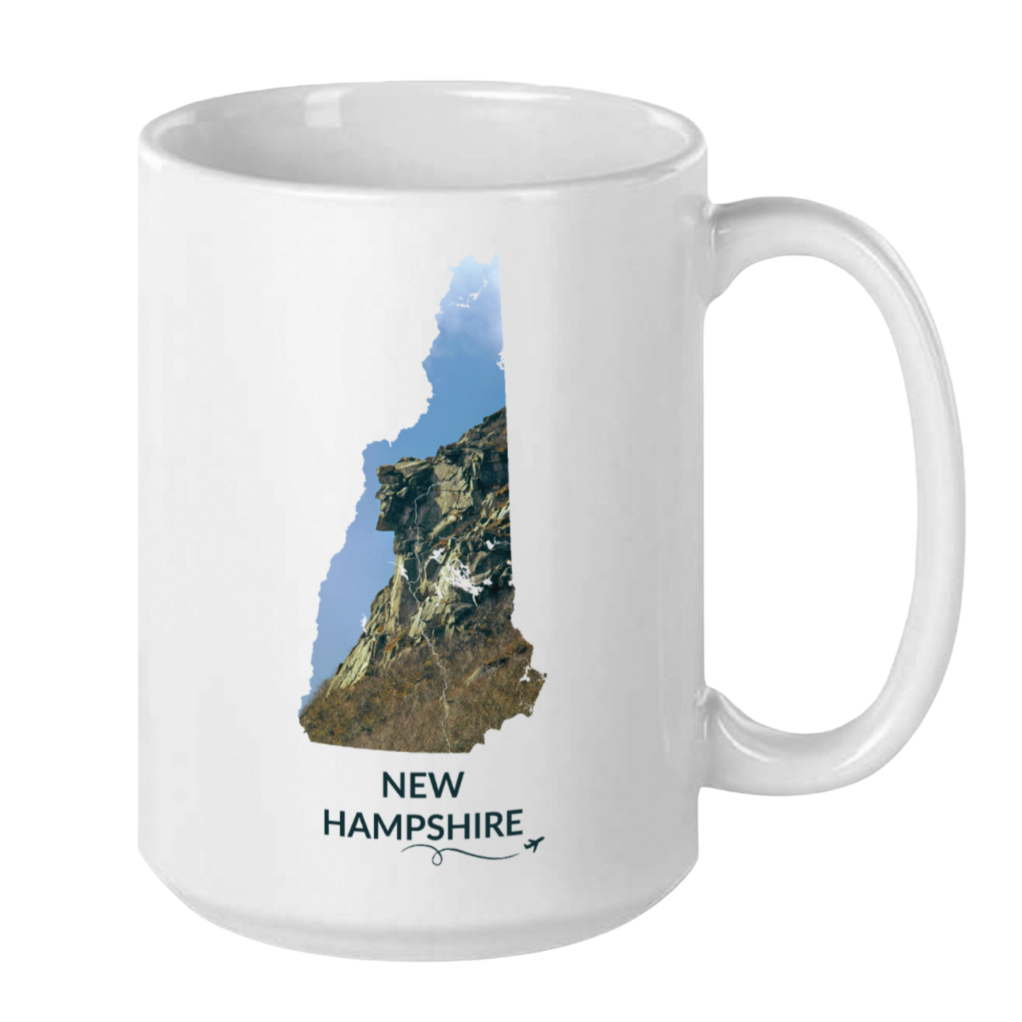 White 15 oz ceramic mug featuring a hand-drawn New Hampshire outline filled with a photograph of the Old Man of the Mountain. The words “New Hampshire” appear below the artwork with a small airplane icon and looping flight path.